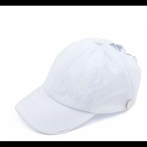 C.C. Side button white criss-cross ponytail cap.
